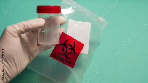 Foto Gloved Hand with Specimen Containers and Biohazard Bag — Medical Sample Collecti