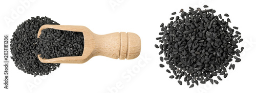 Nigella sativa or Black cumin in wooden scoop isolated on white background. Top view. Flat lay