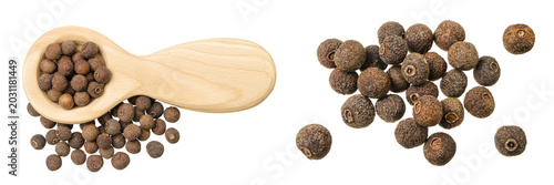 Allspice pepper in wooden spoon isolated on white background. Jamaica pepper, Pimenta dioica or myrtle pepper. Top view