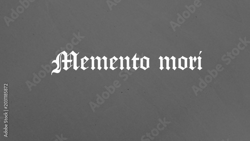 Konstfotografi White gothic lettering spells Memento mori across a dark, textured grey background