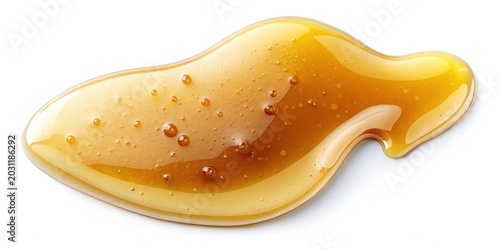 Golden caramel syrup drizzled over crispy waffle on white background