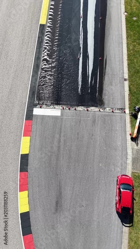 Vertical Aerial Top Down View of Car on Race Track Braking Lane