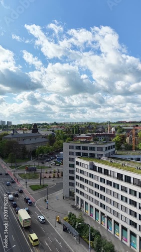Vertical Aerial City View with Clouds Street Traffic and Modern Buildings