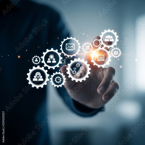 Businessman touching virtual gears with icons, representing business process automation and digital transformation.