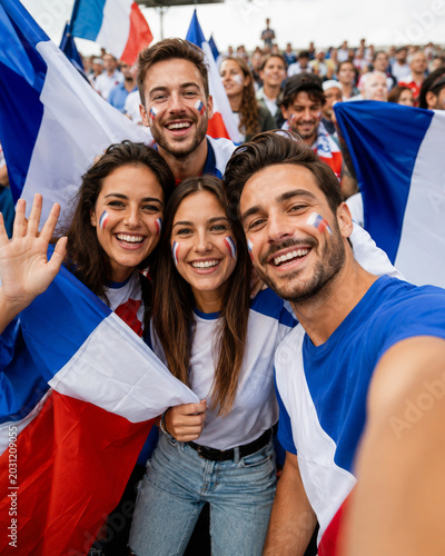 French football supporters taking selfie during soccer celebration