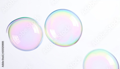 Pearlescent spheres shimmer with rainbow hues against a clean, bright backdrop