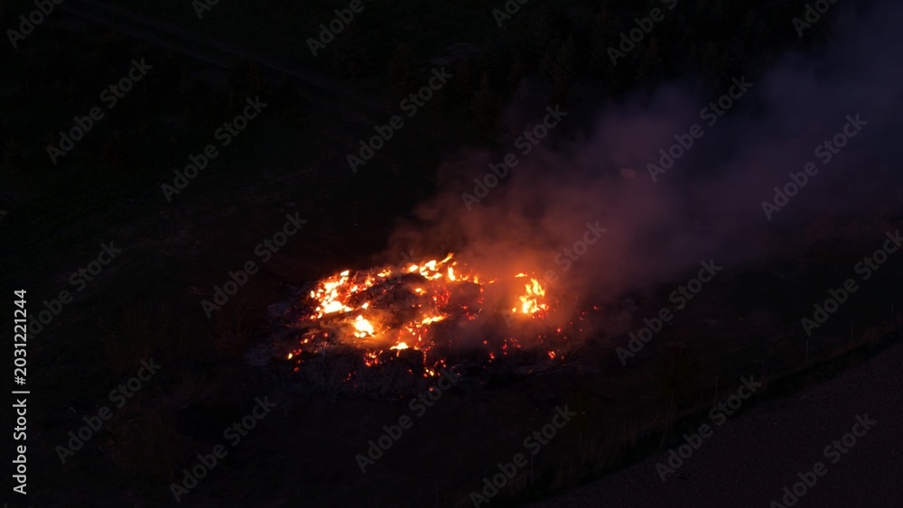 Fototapeta premium Traditional Walpurgis Night bonfires burning across Czech countryside during evening celebration