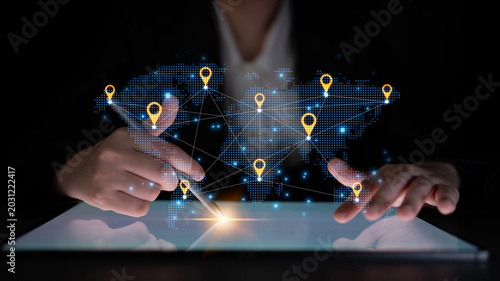 Photos Concept of a global logistics network with location pins on a world map