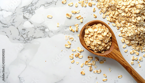 Organic Oatmeal Scattered on White Marble Surface with Wooden Spoon, Natural Skincare Ingredient Flat Lay with Copy Space