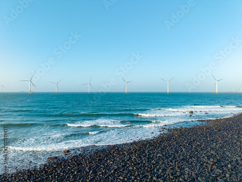 Modern offshore wind turbines stand in the sea off the coast of Pingtan in Fujian China