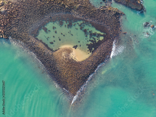 Photos Aerial view of the unique heart shaped stone fish trap in the coastal waters of