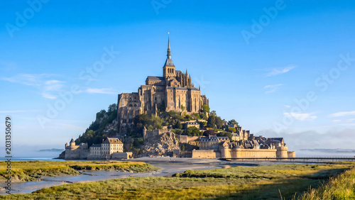 Obraz na plátně Mont Saint Michel abbey perched on rocky island at low tide