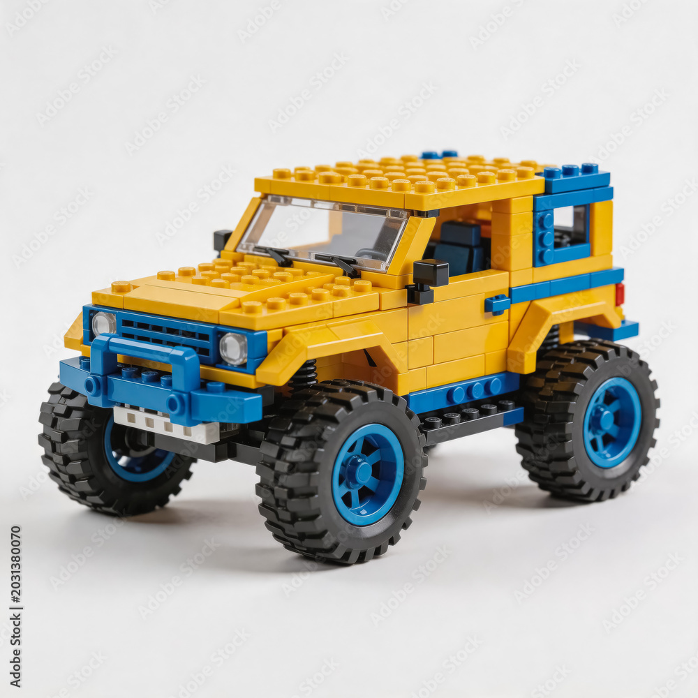 Naklejka premium A detailed built Lego off-road jeep model, featuring yellow and blue color scheme, large off-road tires, and realistic vehicle styling on a neutral white background.