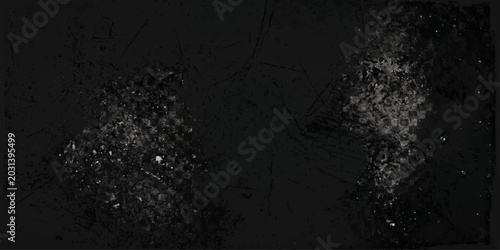 Dark grey grunge texture of rain drops on a black window pane with an abstract concrete wall and blue winter sky backdrop