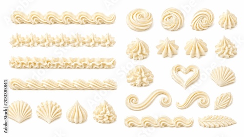 Whipped cream swirls and piping borders set, vanilla buttercream frosting elements, decorative sweet cake topping swirls on white background