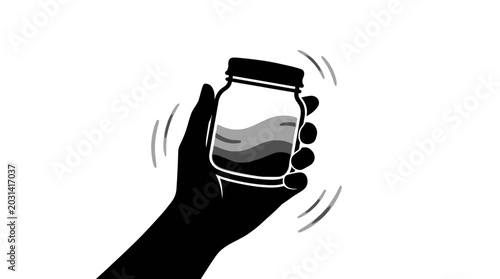 Foto Hand holding a mason jar.