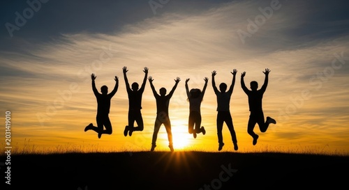 Joyful Silhouettes of Friends Jumping Together Against a Vibrant Sunset Sky
