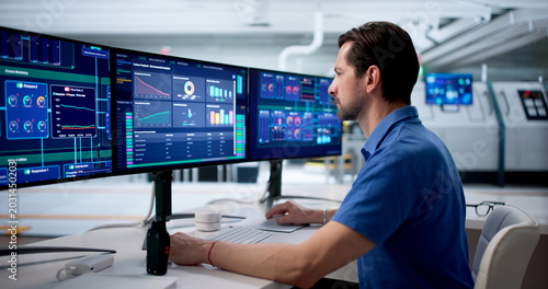Принти на полотні Experienced Engineer Watches SCADA System Controlling Factory Process