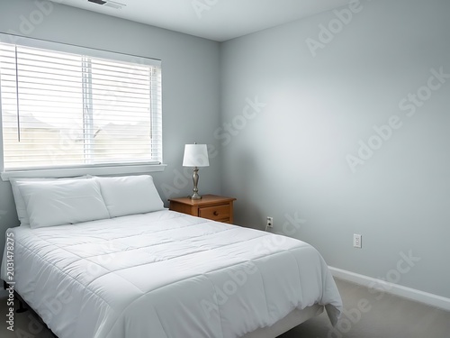 Minimalist Bedroom Interior with White Bedding and Wooden Nightstand