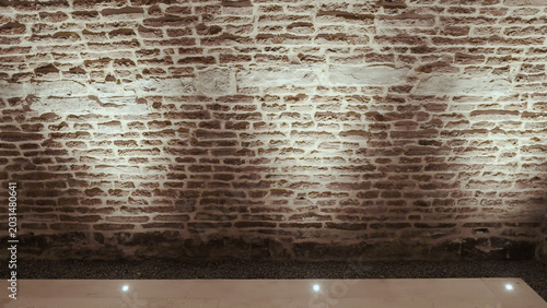 Εκτύπωση καμβά Illuminated brick wall texture exhibition space with dramatic rustic atmosphere