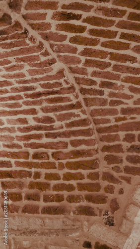 Foto Corner brick wall texture background with rustic masonry pattern