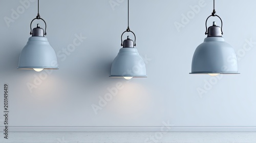 Three industrial style pendant lamps illuminate a minimal interior space