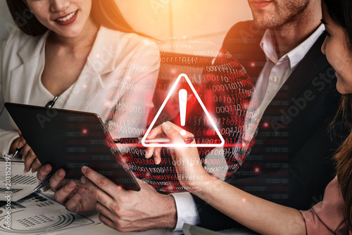 Canvas Print Business professionals engage in a discussion about digital security measures, emphasizing the importance of data protection within a contemporary office environment