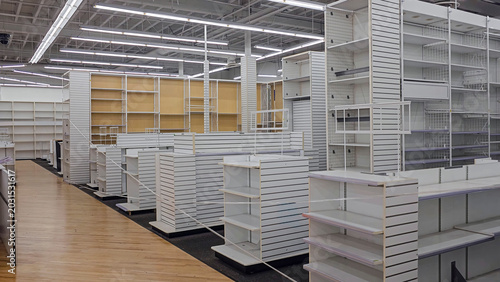 Fotografi Empty retail store interior with white shelving
