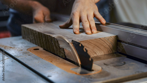 Bild auf Leinwand Wood board cutting with electric saw in a carpentry workshop