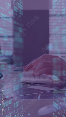 Vertical video: Hands starting typing and moving mouse on desk for analysis, animating tech overlay