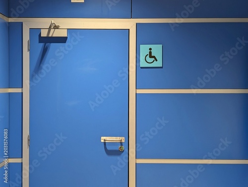 Blue Door with Wheelchair Accessibility Sign