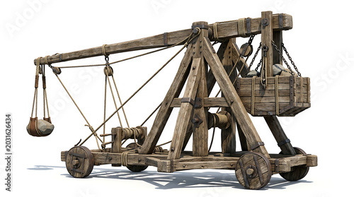 Medieval wooden catapult isolated on a white background with a stone projectile ready to launch