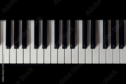 Piano and Piano keyboard with black background.