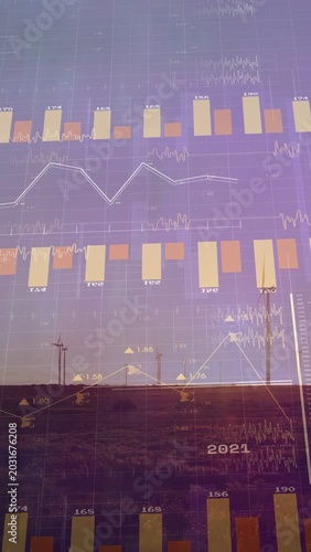 Vertical video: Digital grid rising, turbines standing, clear bar charts scrolling showing power