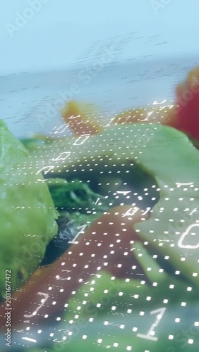 Vertical video: Camera panning showing avocado while binary grid sweeping across measuring ripeness