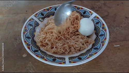 tutorial for cooking original boiled instant noodles, instant noodles on a plate ready to serve