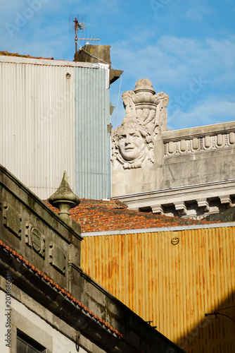 Old porto building with statue of other building as contrast