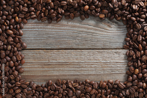 Coffee beans frame on wood