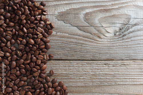 Roasted coffee beans on wood