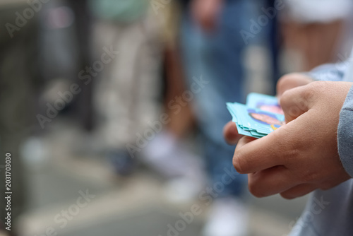 Boy Hands Exchanging Soccer Stickers. Selective focus. Space for text