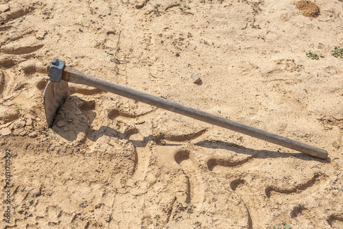 Old hoe on the ground. 