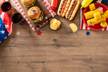 Fourth of July barbecue food background with burgers hot dogs and copy space