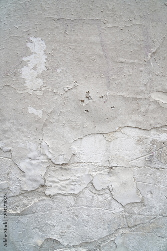 Cracked concrete wall texture with weathered surface and grunge background