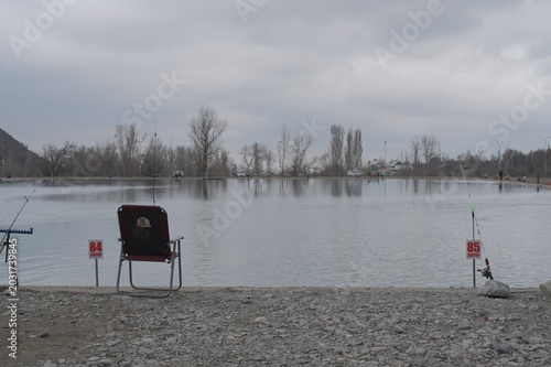 Fishermen angling on the shores of a trout pond in Issyk Gorge