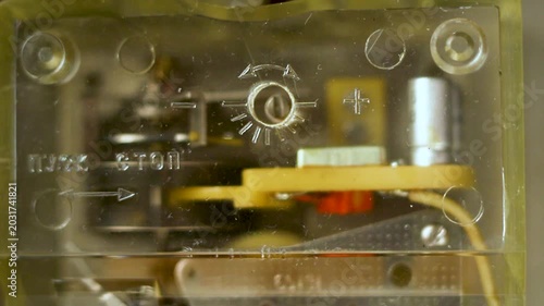 Vintage electronic circuit board with transparent plastic casing and internal components