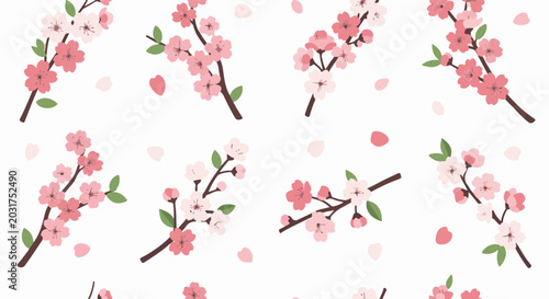 Delicate pink cherry blossoms bloom on brown branches, petals drift
