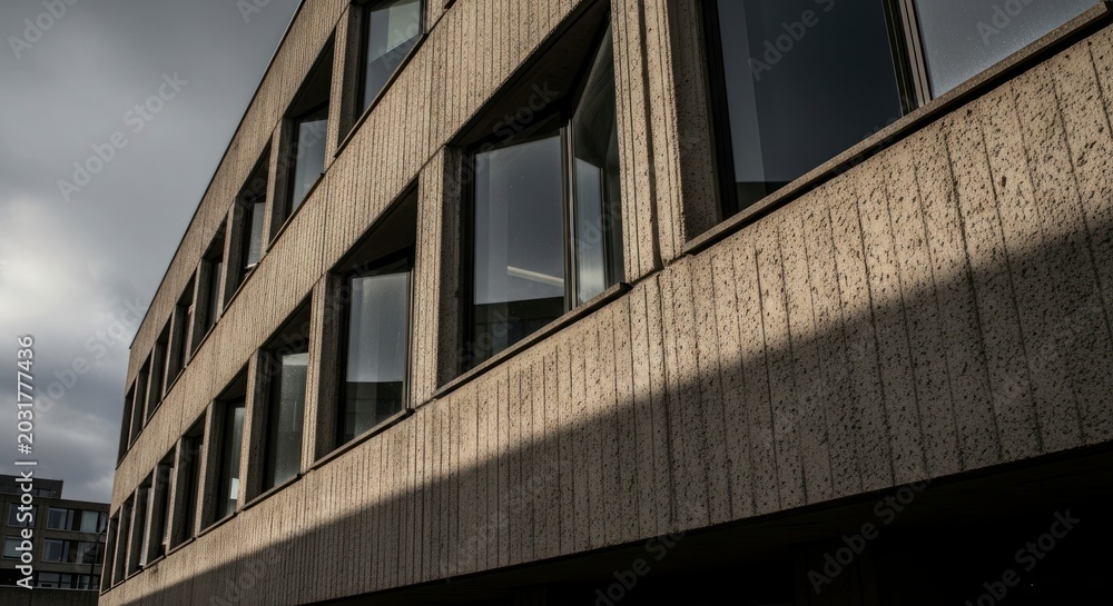 Fototapeta premium Modern building exterior with windows.
