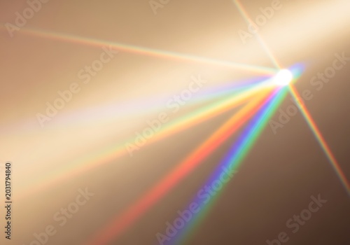 Rainbow Lens Flare With Light Streaks on Warm Background