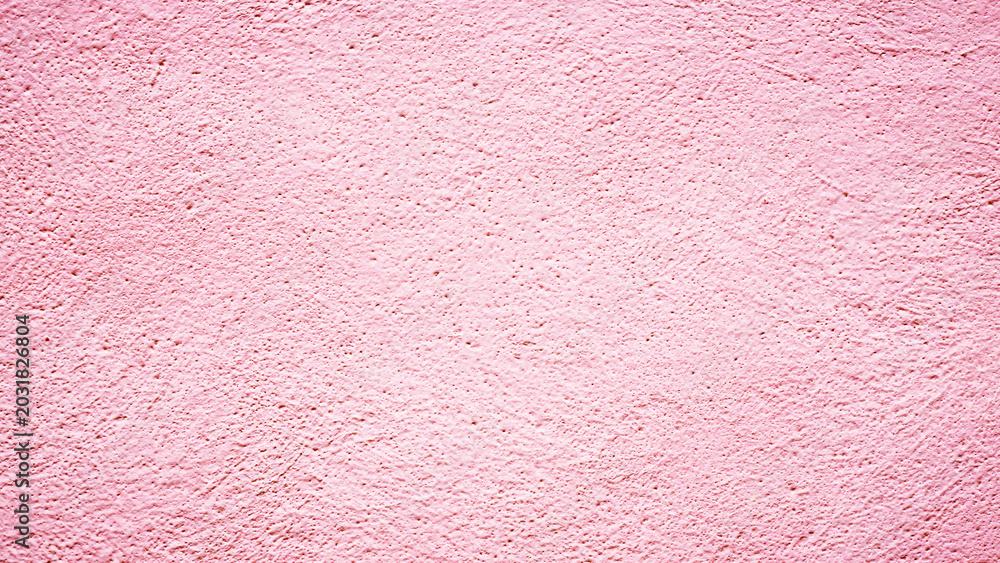 Fototapeta premium Wall with pink texture in a simple design showing unique patterns during daylight