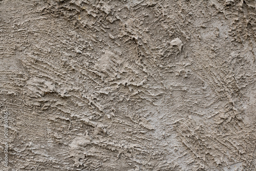 A Full Frame Texture of a Rough Concrete Wall Surface with Uneven Plastering Lines Formed Extensively for Abstract Industrial and Construction Backgrounds